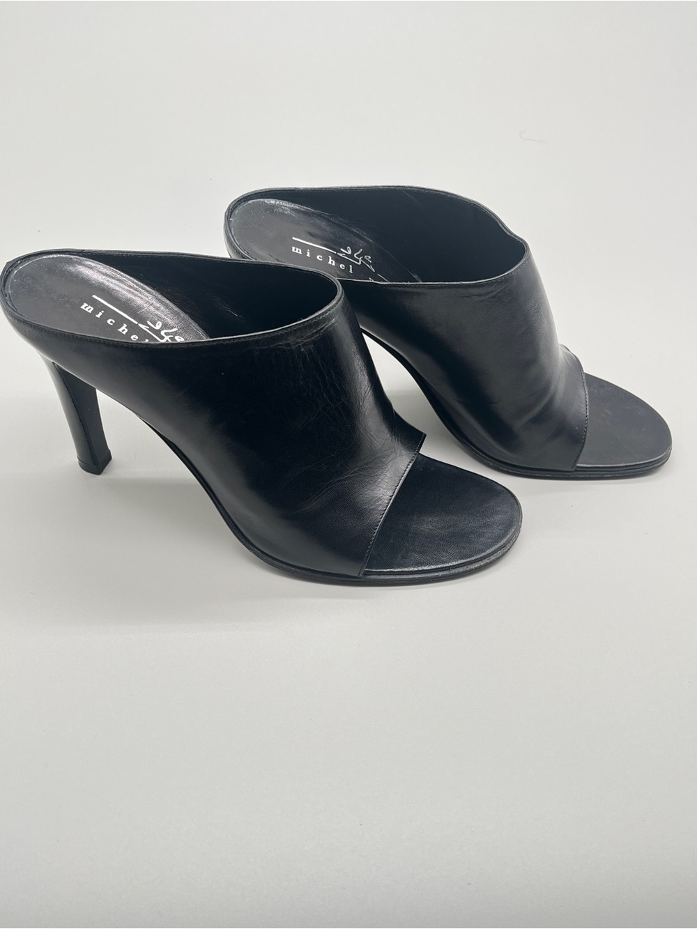 Michel Perry black heeled mules. wide leather strap. Made in Italy. Size 37.